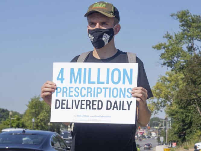 Group rallies at Goshen post office in support of postal workers News