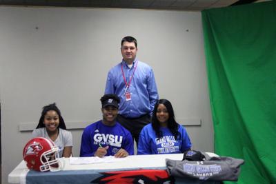 Rummel Johnson Of Goshen Inks Letter To Grand Valley State Local