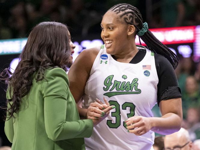 Notre Dame head coach Niele Ivey speaks with Notre Dame center Lauren Ebo