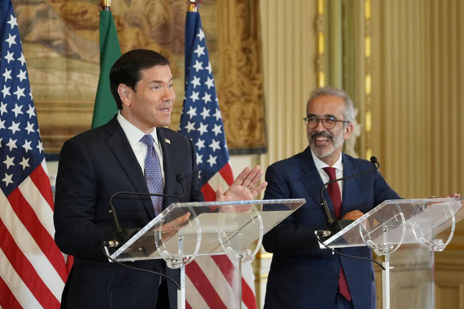 US Secretary of State Marco Rubio standing with Portuguese Foreign Minister Paulo Rangel during a press meeting.
