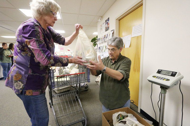 Volunteers help deliver relief for food needs