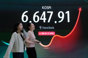 Stocks hover near record highs and oil prices stabilize with talk of a deal to open Strait of Hormuz