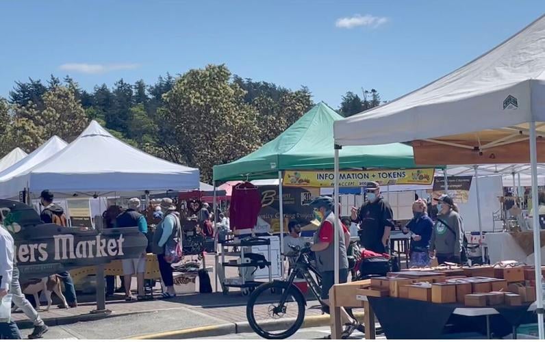 Crowd gathers for Anacortes Farmers Market opening News