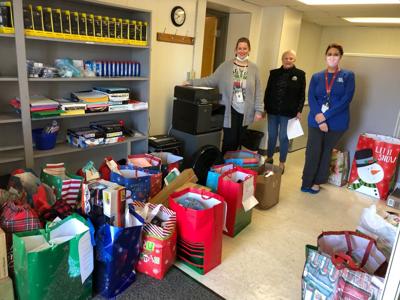 Youth Builders Deliver Gifts To The Health Department