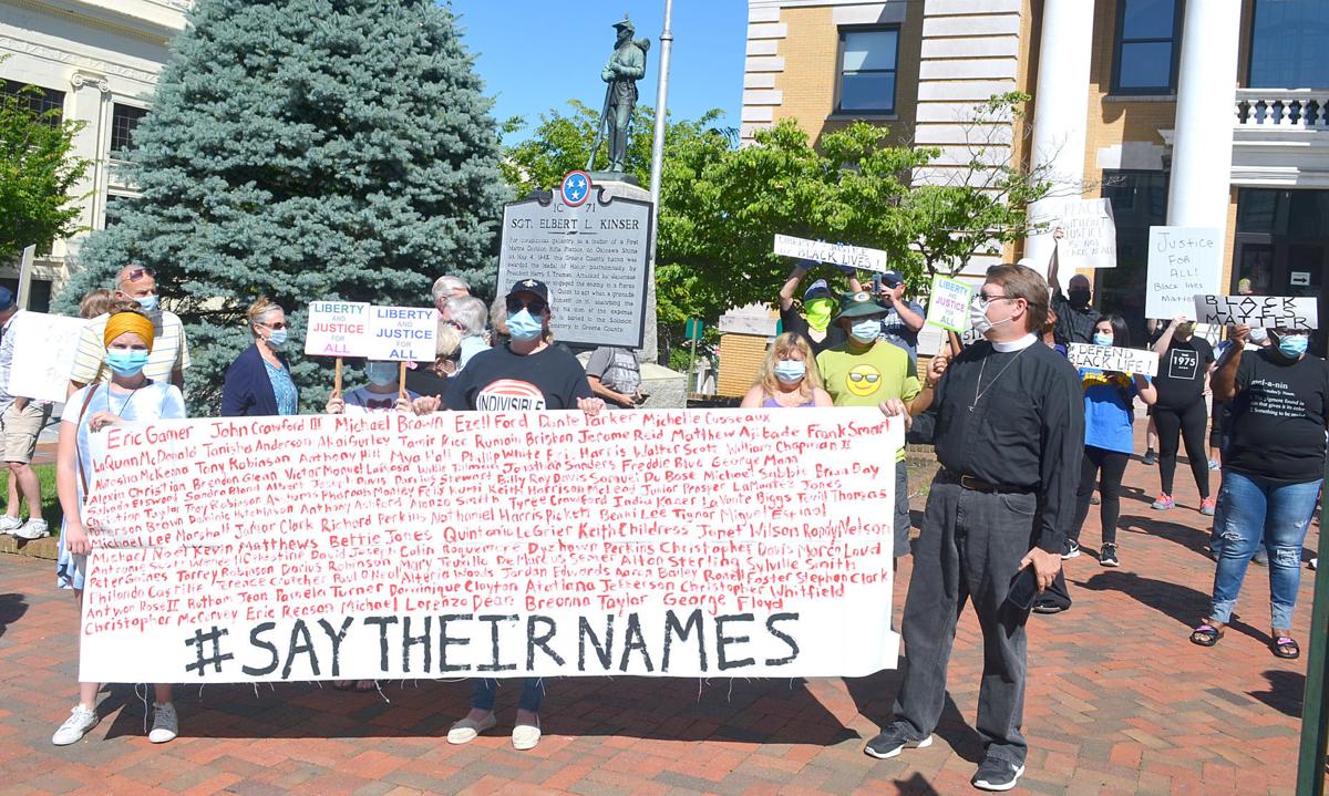 'Say Their Names' Sign WIth Victims