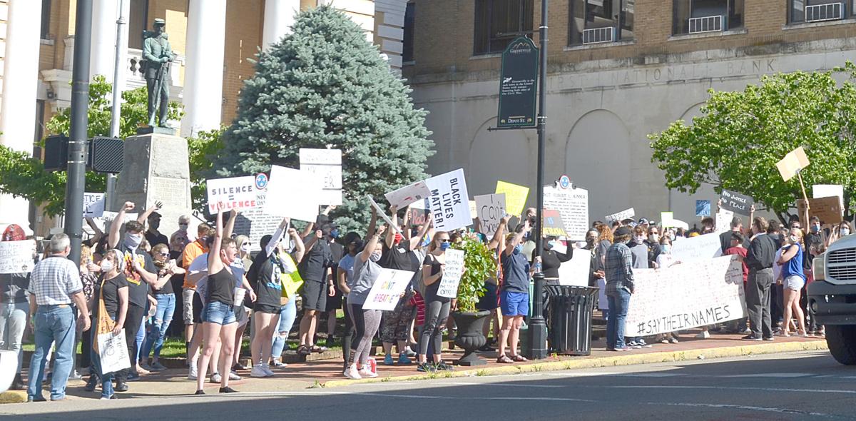 Waving Signs At Passing Traffic