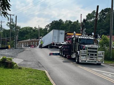 Semi Truck Stuck On Irish Street Railroad Tracks Halts Train | Local ...