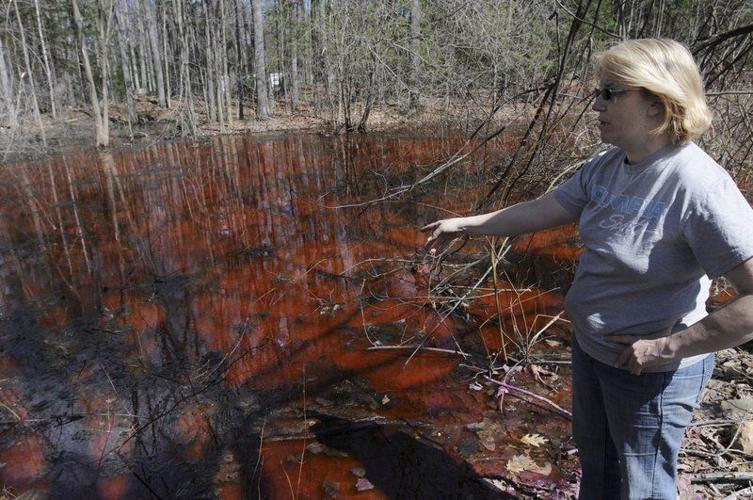 Danville dispute turns pond red