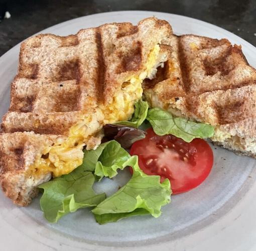 Waffle sandwich with a side of lettuce and tomato
