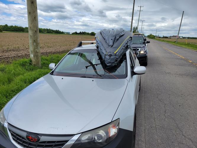Canoe on car windshield