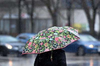 Person under umbrella on rainy day