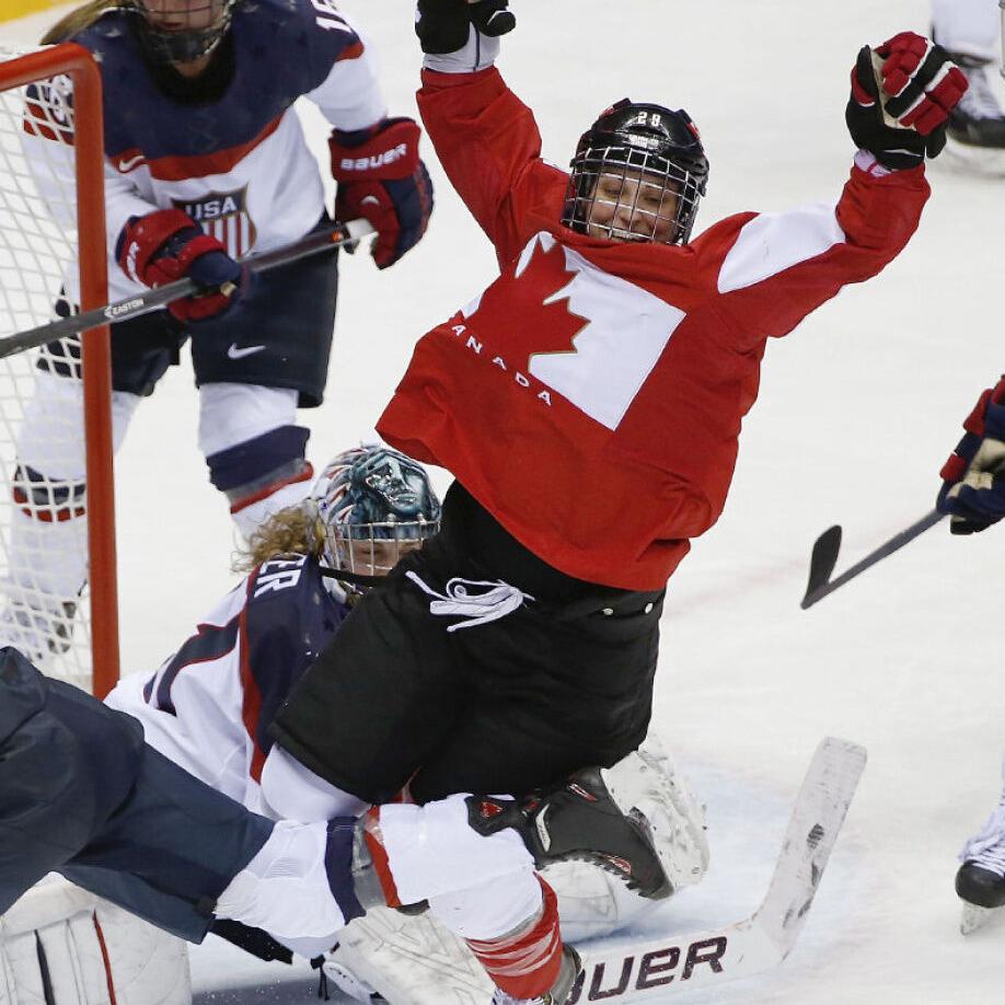 USA defenseman Anne Schleper (15) cross checks Canada forward Jayna Hefford  (16) in the second period of the women's hockey gold medal game at the  Bolshoy Ice Dome during the Winter Olympics