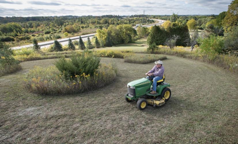 Andy Sitler mows grass