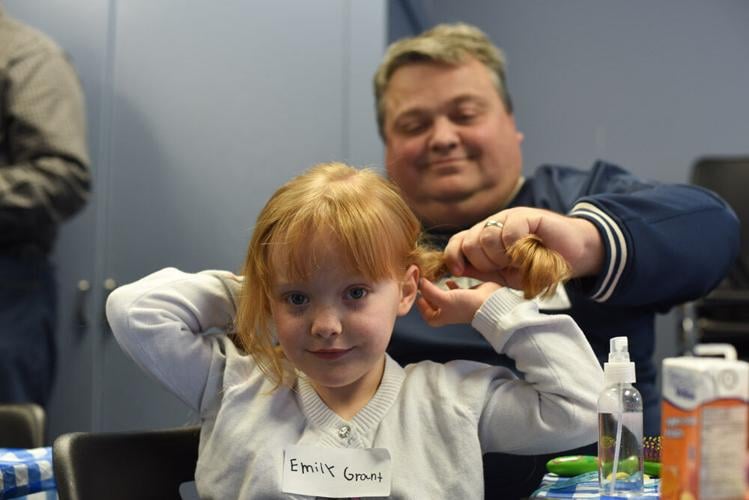 Guelph dads learn basic braids, buns and brushing techniques