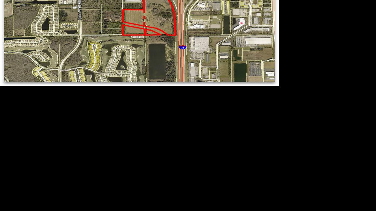 Aerial view of 60-acre Daniels Parkway land sale