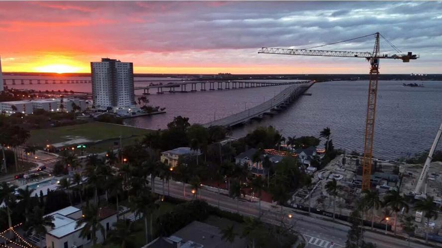 Riverfront construction rises beside Fort Myers bridge