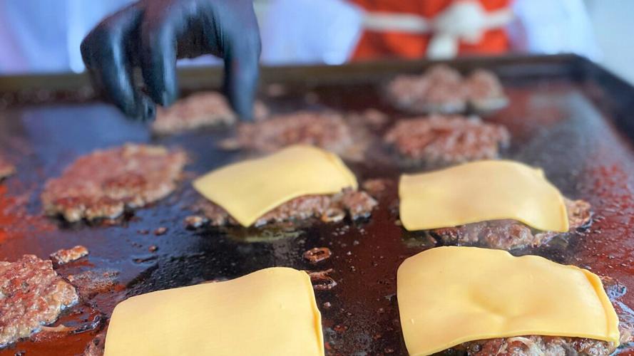 Kyle Cravo prepares signature burgers