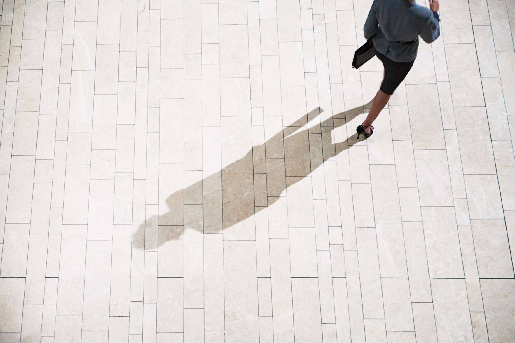 Businesswoman running in lobby