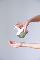woman-applying-hand-sanitizer-3987142