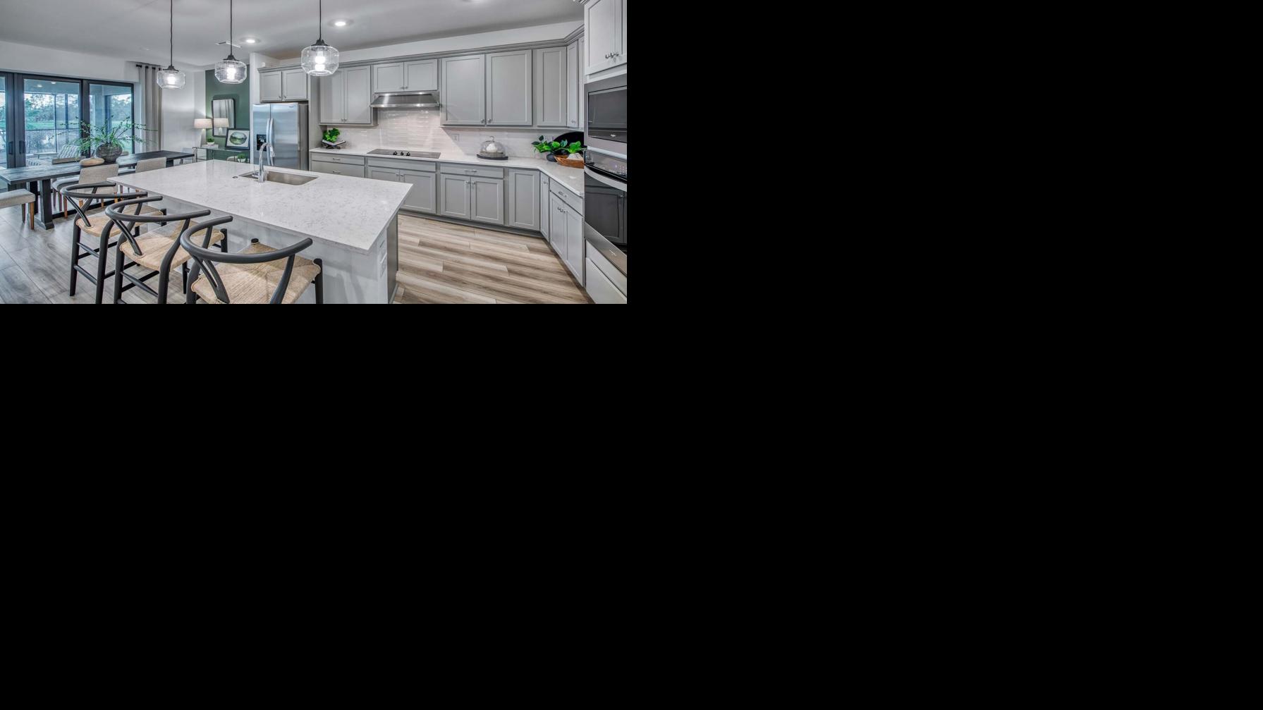 A model home kitchen illustrates the open floor plans planned for Cassia Bay, where PulteGroup homes will range from 1,256 to 2,703 square feet with three to four bedrooms and two- and three-car garages.