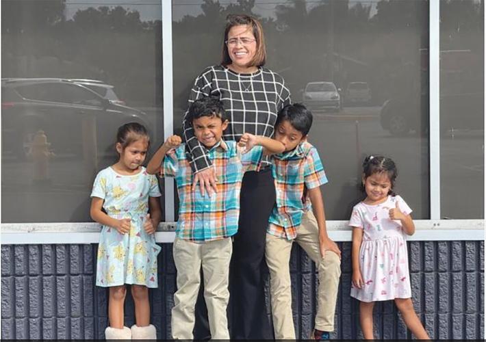 Immokalee Aldi 1926 A Maria Salinas and her four kids on Winn-Dixie closing day - WINK News.jpg
