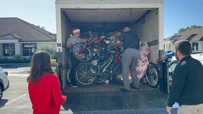 Arthrex Inc. team unload donated toys and other gifts for Collier CAC.jpg