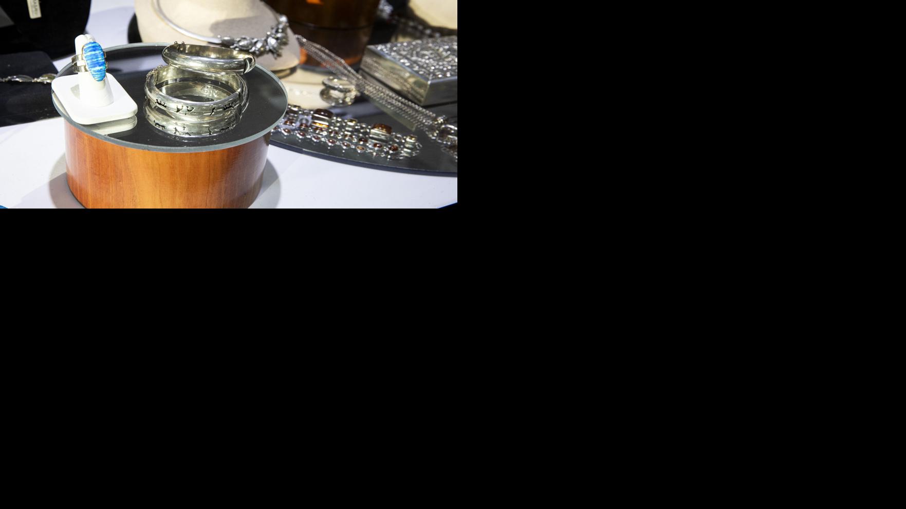 Silver jewelry and bullion are displayed for sale at Gulfcoast Coin & Jewelry