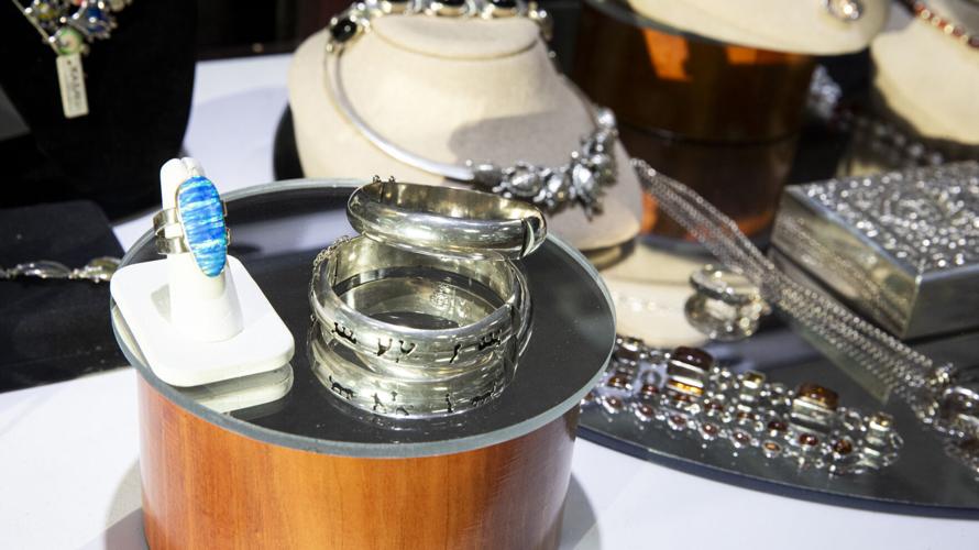 Silver jewelry and bullion are displayed for sale at Gulfcoast Coin & Jewelry