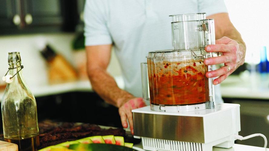 Jeff Mitchell prepares fire-roasted salsa
