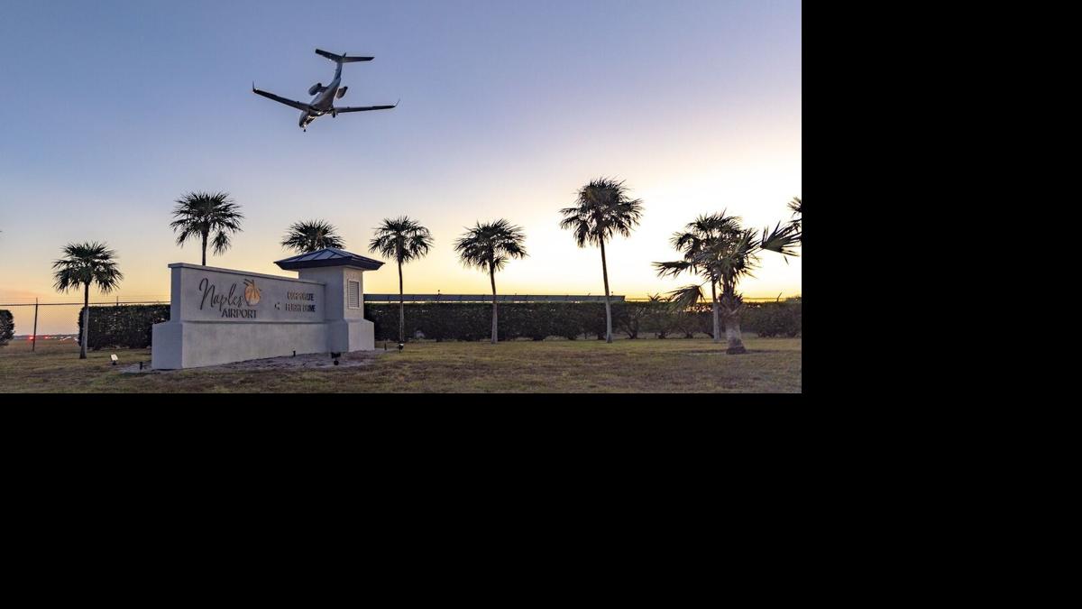 A jet makes its final approach into Naples Airport as the sun sets on the horizon.jpg