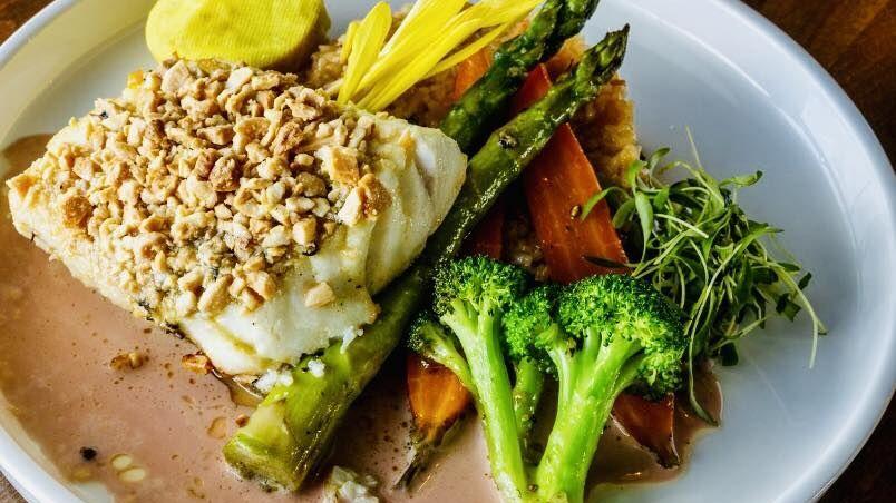 Almond- and cashew-crusted halibut served at The Islands