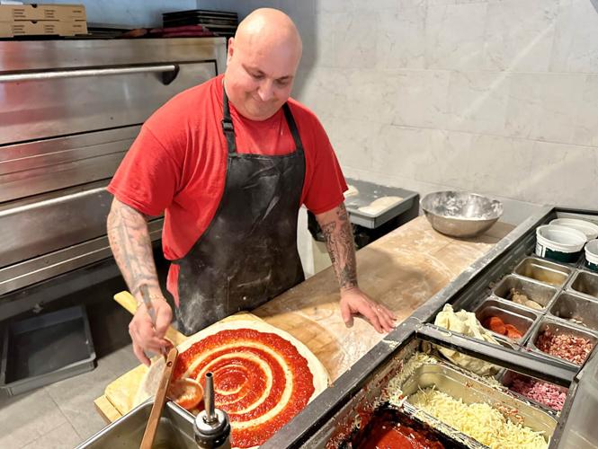 Pizza preparation highlights Naples Italian dining