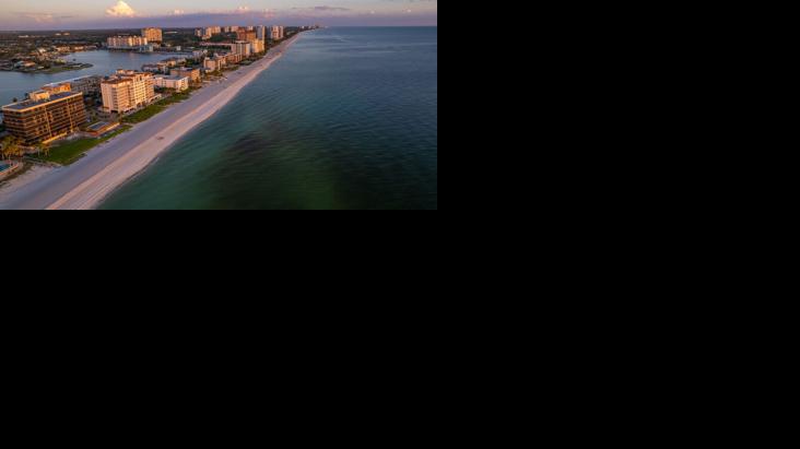 Aerial drone photo Naples Vanderbilt Beach Florida, at sunset