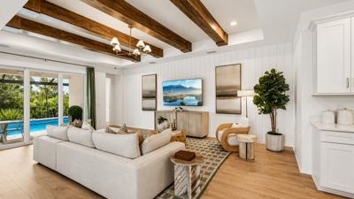The Amelia model features an open living area and access to an outdoor pool. The four-bedroom, three-bath design is the first home under construction at Sandpiper Pointe, on the west side of Pine Street just north of Medical Boulevard in Englewood.