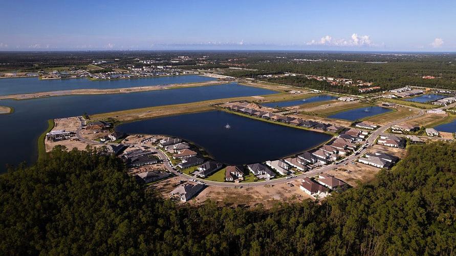 Caymas aerial shows growth of Collier County luxury community