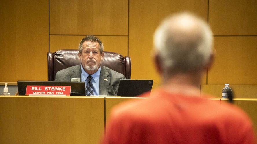 Cape Coral official hears resident during utility hearing