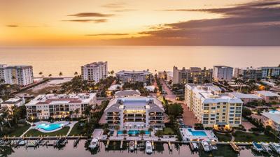Naples bayfront penthouse with boat slip to auction