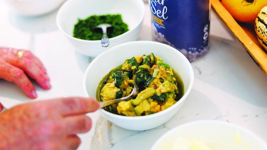 Fabrizio Aielli prepares zucchini for his family risotto