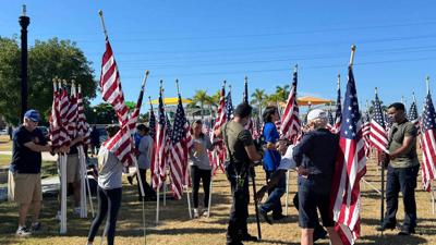 Punta Gorda Rotary volunteers prepare Healing Field of Honor flags