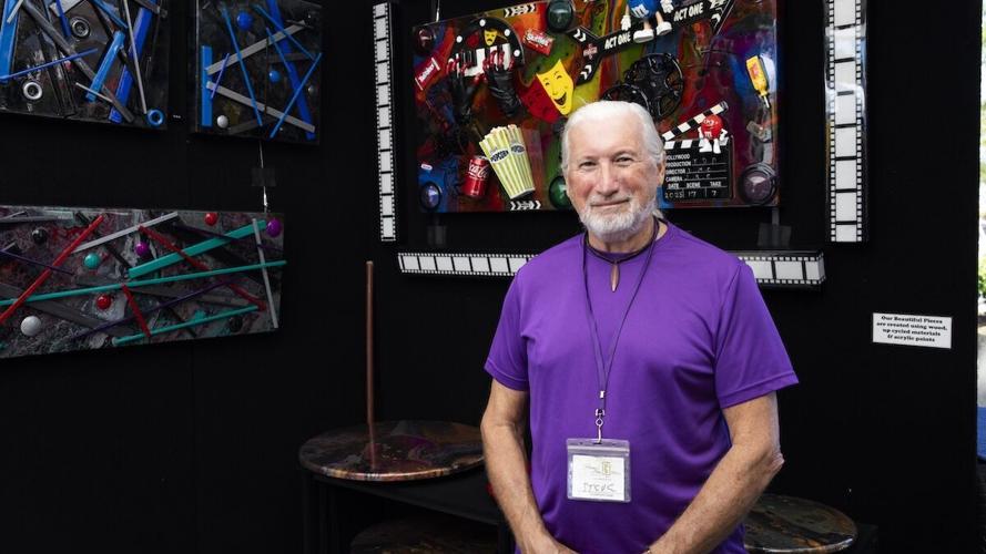 Steve Cebula stands in his booth at Coconut Point New Year's Art Festival on Dec. 28