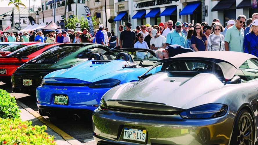 Luxury sports cars line Fifth Avenue South