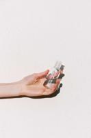person-holding-hand-sanitizer-3962335