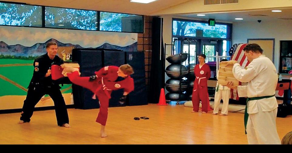 Going on offense Martial arts academy builds people, community