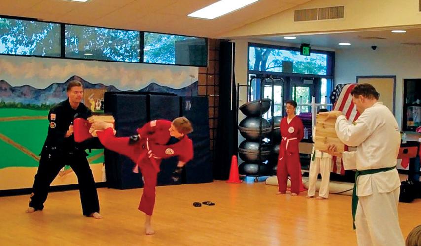 Going on offense Martial arts academy builds people, community