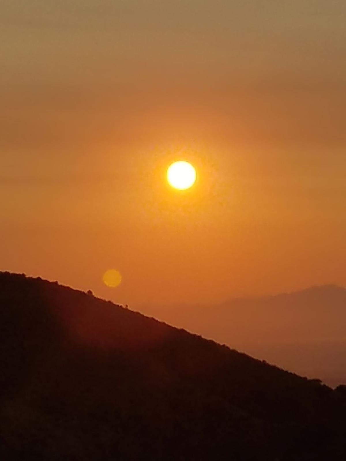 Sun low over the mountain