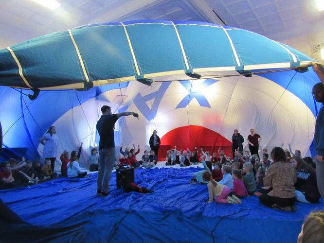 12-02-2022 St. Agnes students sitting inside a ReMax hot air balloon
