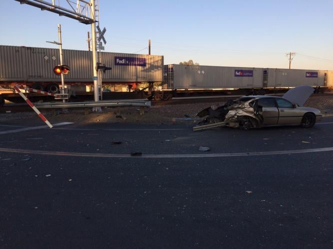 Car struck by train, one person injured