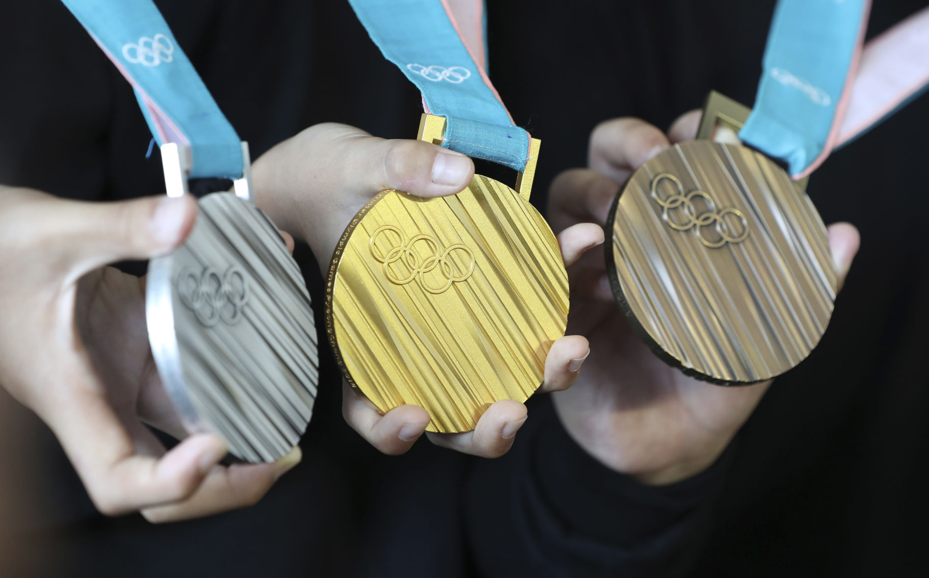 Here's a look at every Olympic gold medal design since 2000