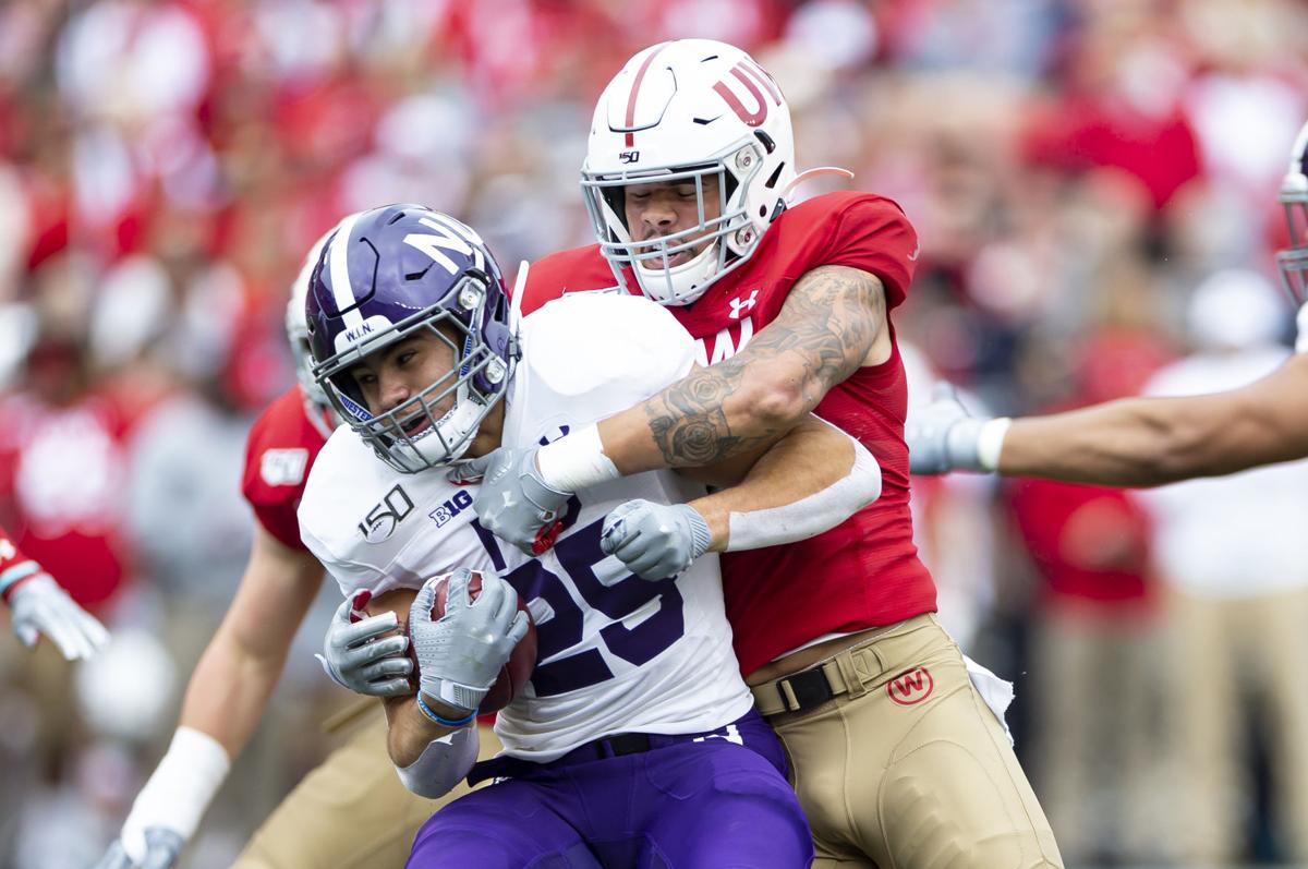 Wisconsin Badgers linebacker Zack Baun (56) tackles Northwestern Wildcats running back Isaiah Bowser (25) on Sept. 28, 2019 at Camp Randall Stadium in Madison, Wis.
