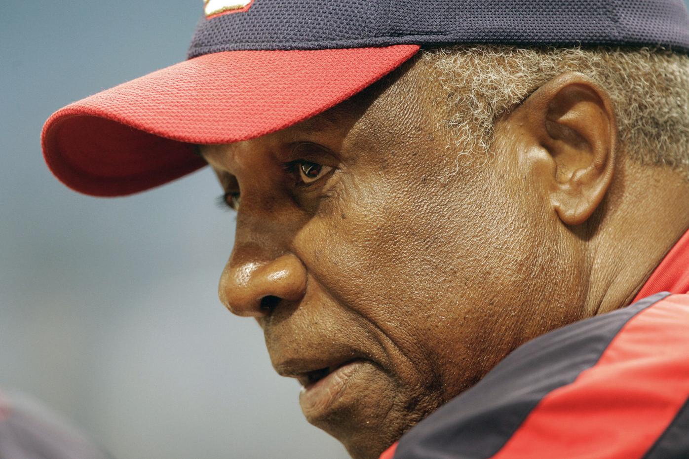 In this April 14, 2005, file photo, Washington Nationals manager Frank  Robinson tips his hat to the crowd as he is introduced during their home  opener against the Arizona Diamondbacks, at RFK